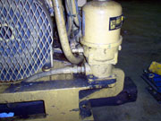 Centrifuge mounted beside an engine