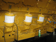 Three Spinner II centrifuges fitted to a large engine